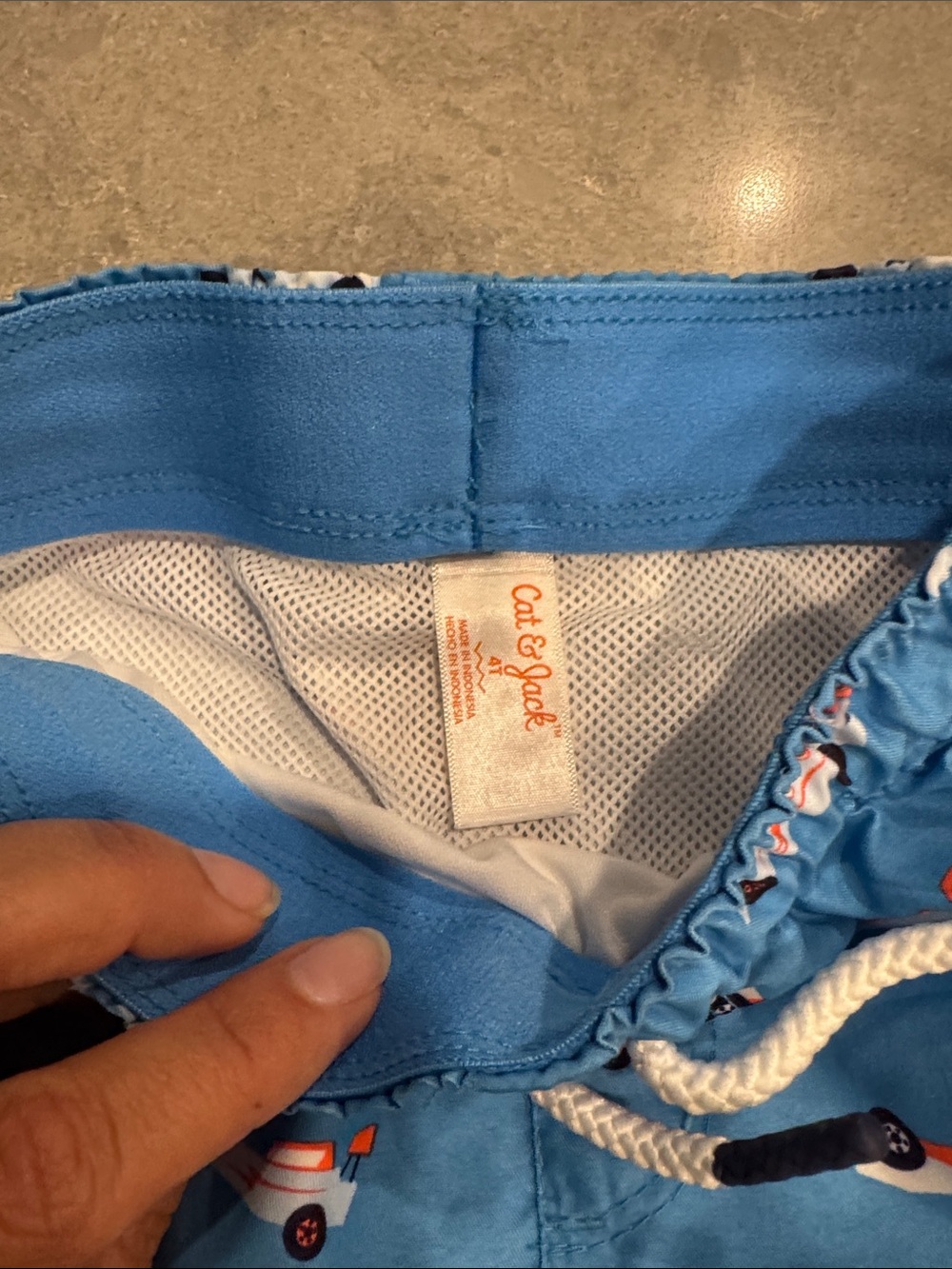Cat & Jack Blue Boys Swim Trunks with Orange and White Race Cars - Picture 2 of 4